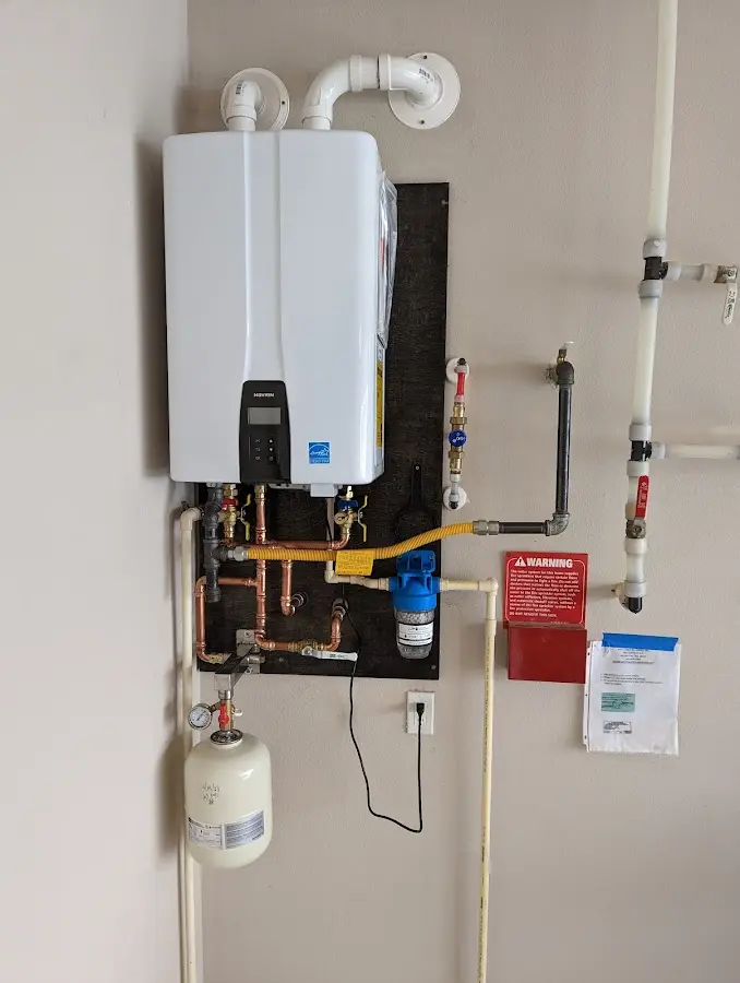 Professional plumber installing copper piping in a Meiners Oaks home